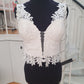 Top 7: EcoChic Bridal/Mikaella lace with plunging V, adjustable 28-31